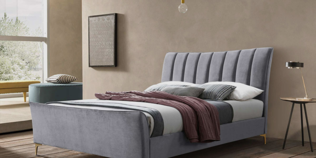 Grey double bed with padded headboard
