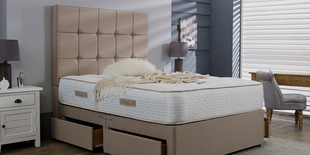 Green king size bed with large headboard